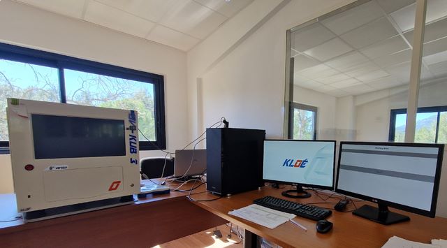 Iridescent ripples of a bright blue and pink liquid